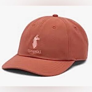 Cotopaxi Dad Hat in a coral clay color. OS
